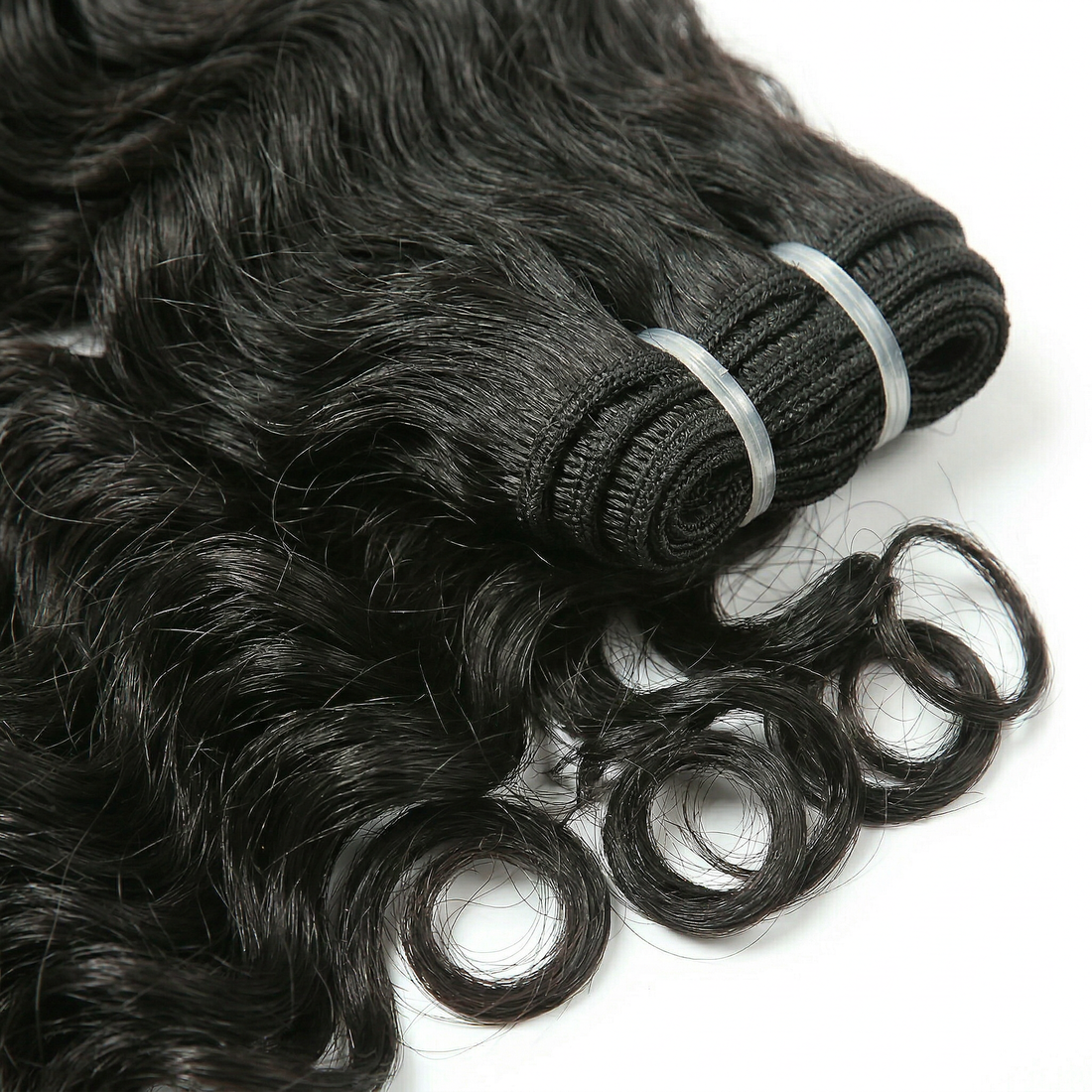 Black loose wave hair extensions on a white background
