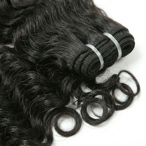 Three bundles of black loose wave hair extensions on a white background
